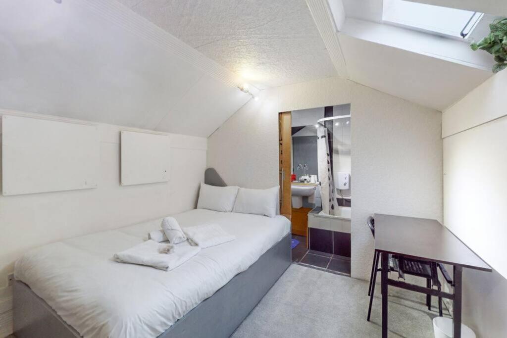 A bright and tidy double bedroom featuring a co...