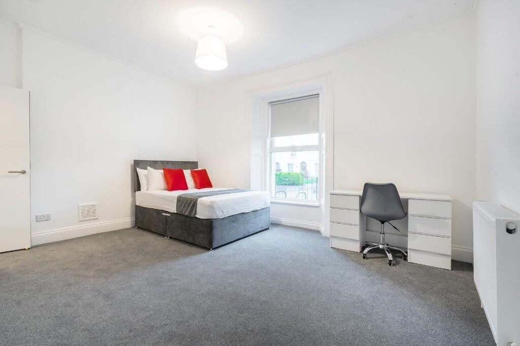 Bright and inviting double bedroom featuring a ...