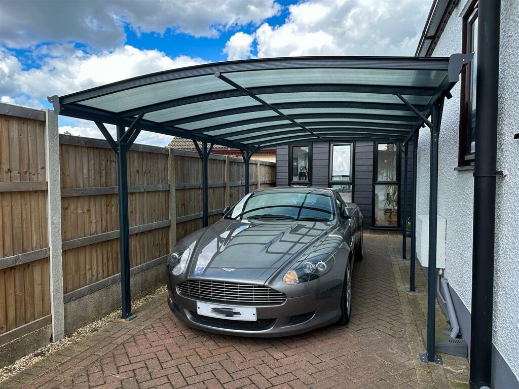 CAR PORT &amp; GATED PARKING AREA