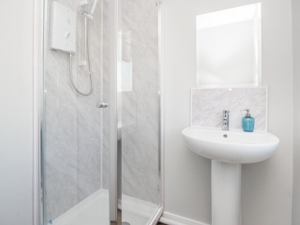 Bright, modern bathroom featuring a clean pedes...