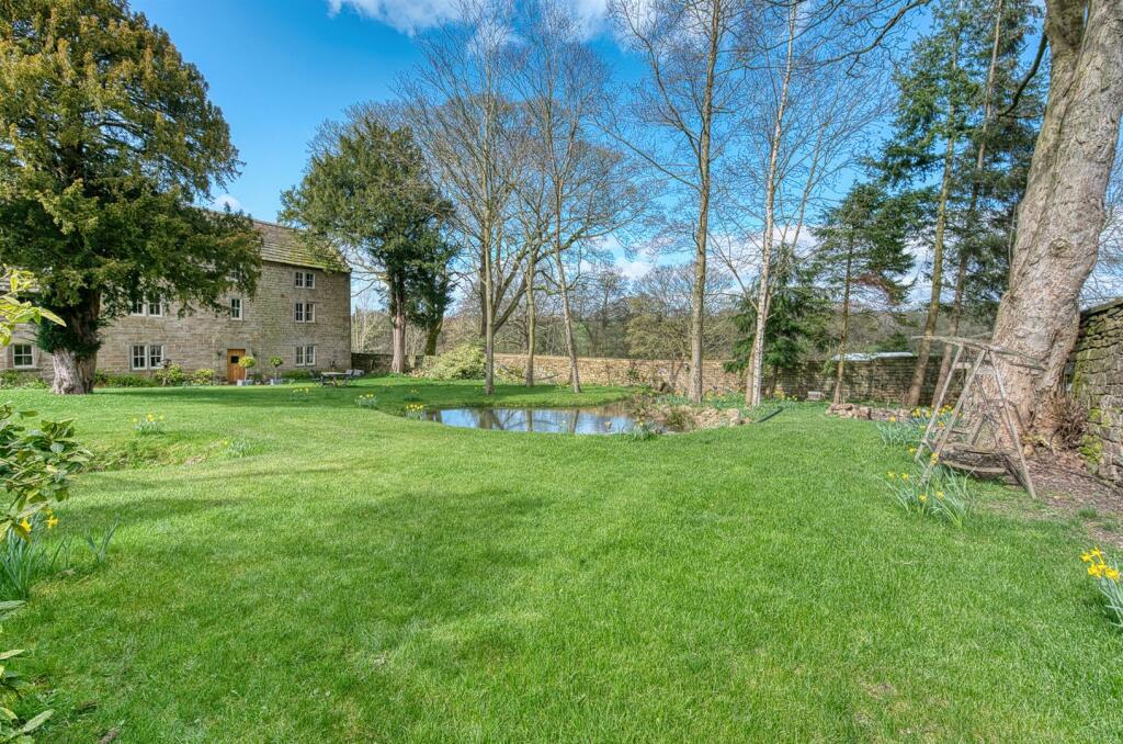 Garden - swing seat and pond towards house.jpg