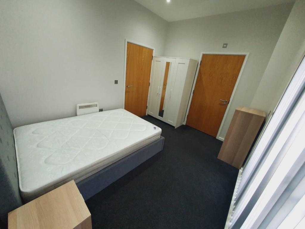 bedroom with en-suite and balcony