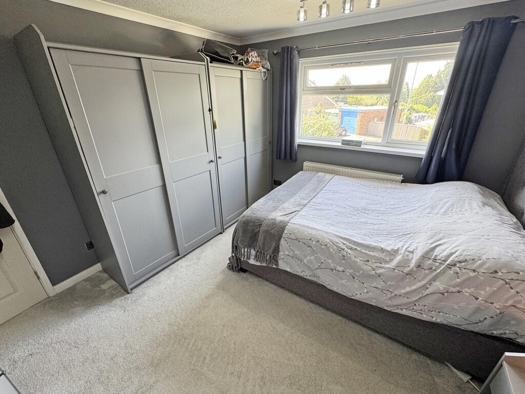 Bed 1 to wardrobe