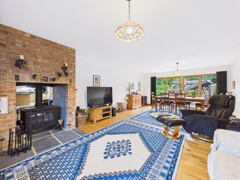 LIVING ROOM WITH STOVE FIREPLACE