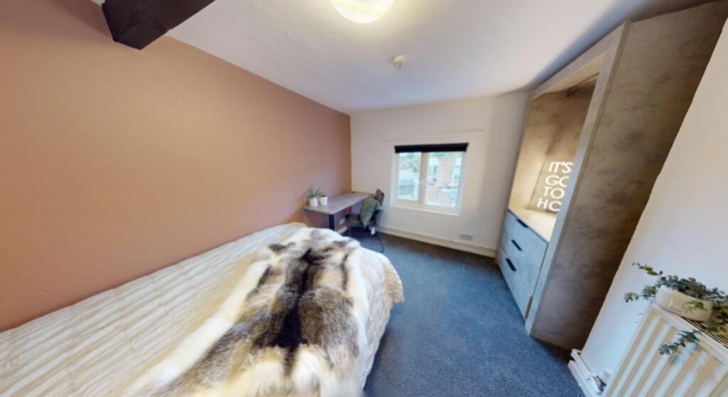 A bright and inviting double bedroom featuring ...