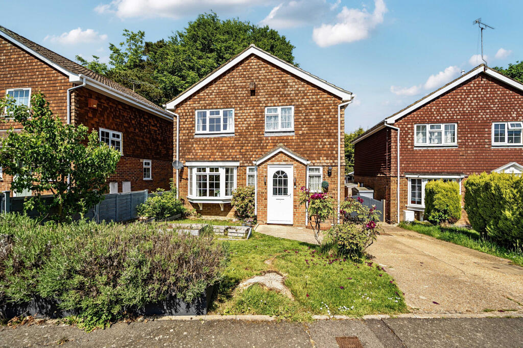 Front elevation, front garden and driveway with parking for two to three vehicles