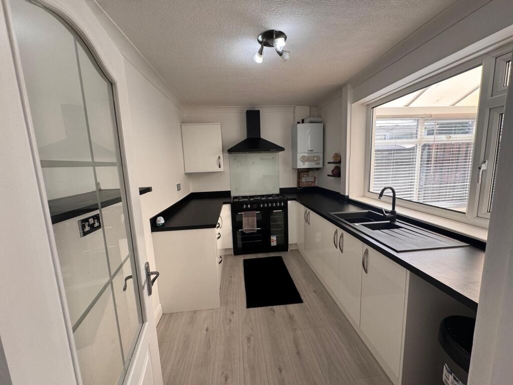 SITTING ROOM KITCHEN AND CONSERVATORY