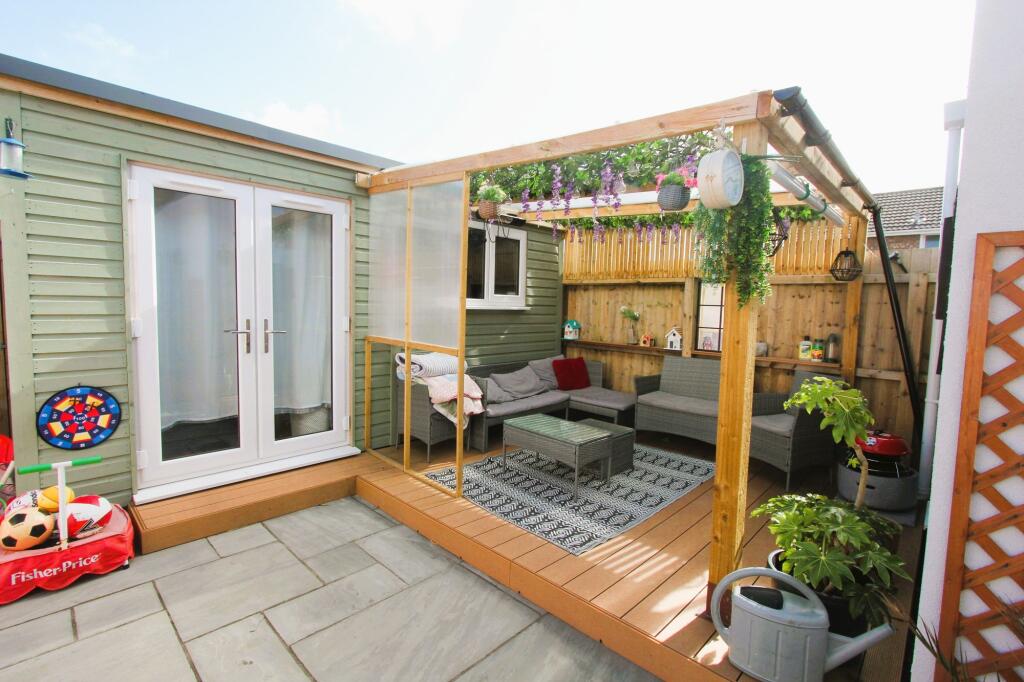 garden office and covered seating area