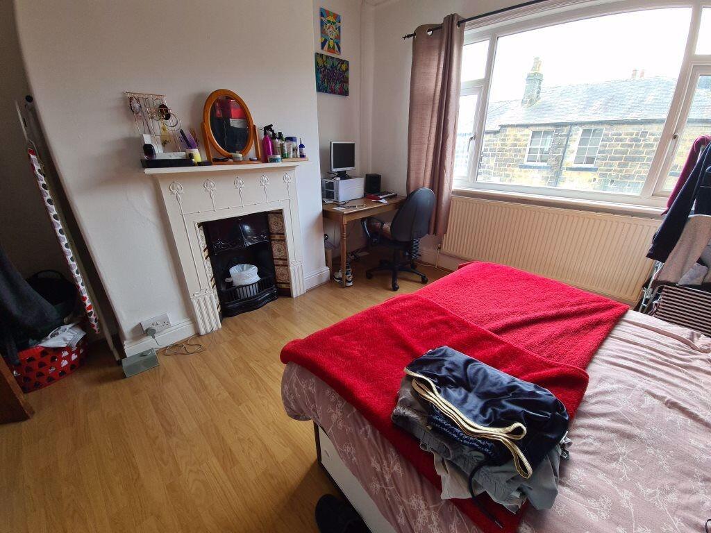 Bright, well-presented bedroom with a large win...