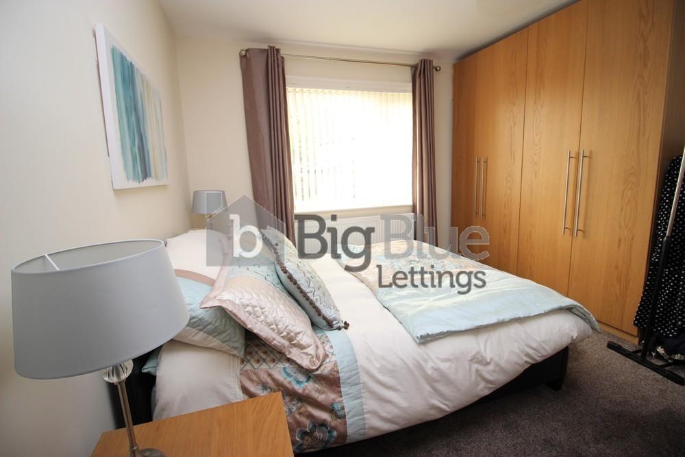 A cozy double bedroom featuring a comfortable d...