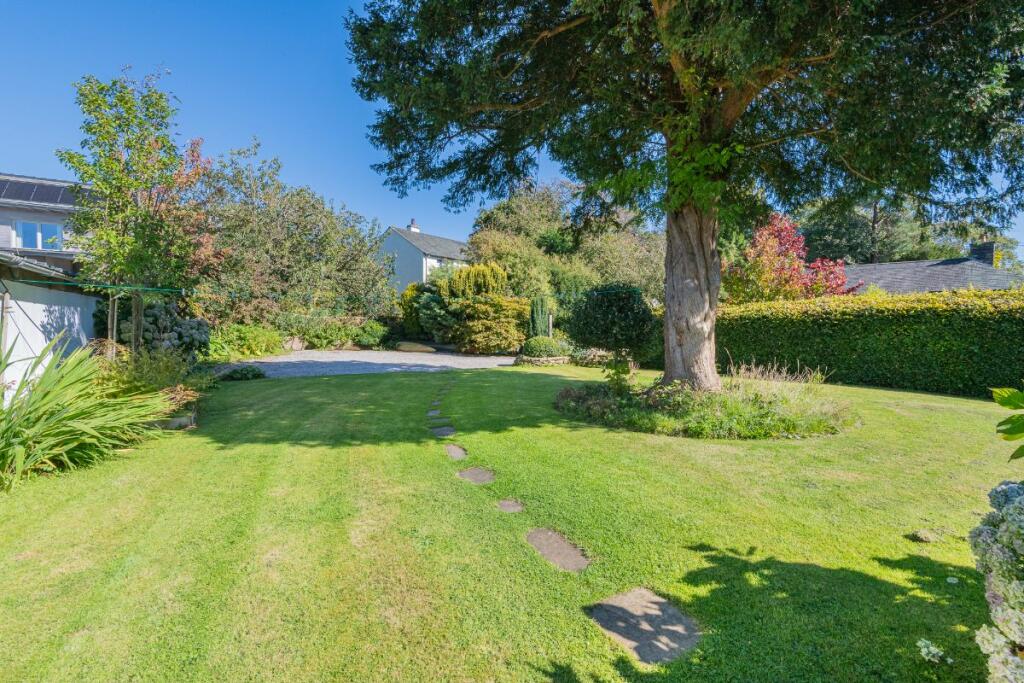 Back garden to parking area 