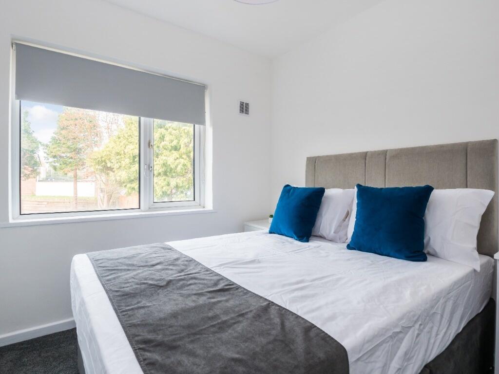 Bright and inviting double bedroom featuring a ...