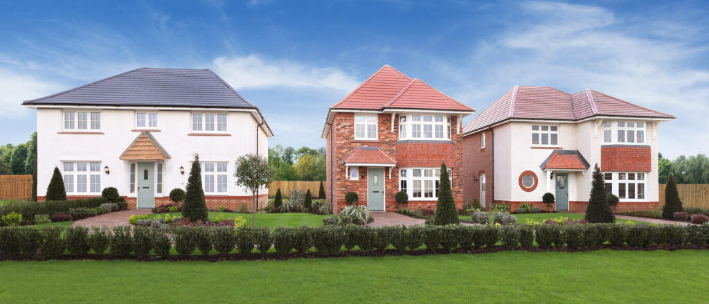 Three modern detached houses with manicured gardens under a blue sky, part of the Hackwood Grange de