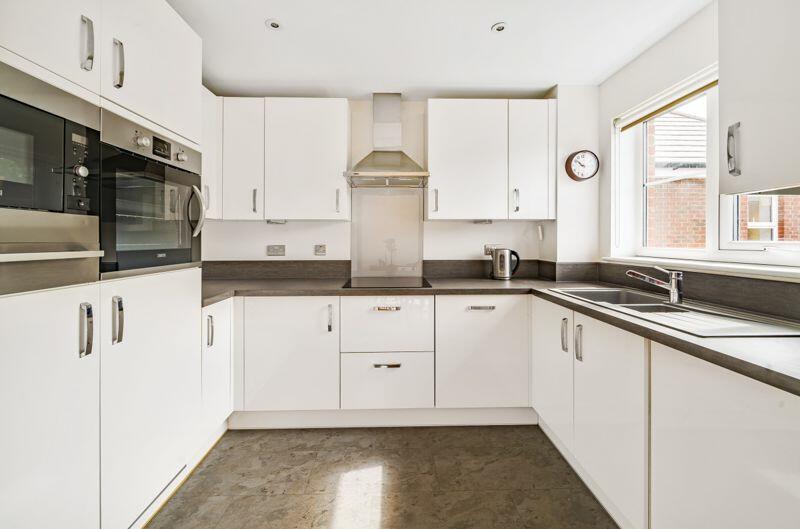 Kitchen with built-in appliances