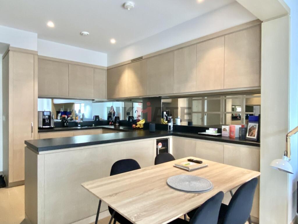 Modern and spacious kitchen with ample storage ...
