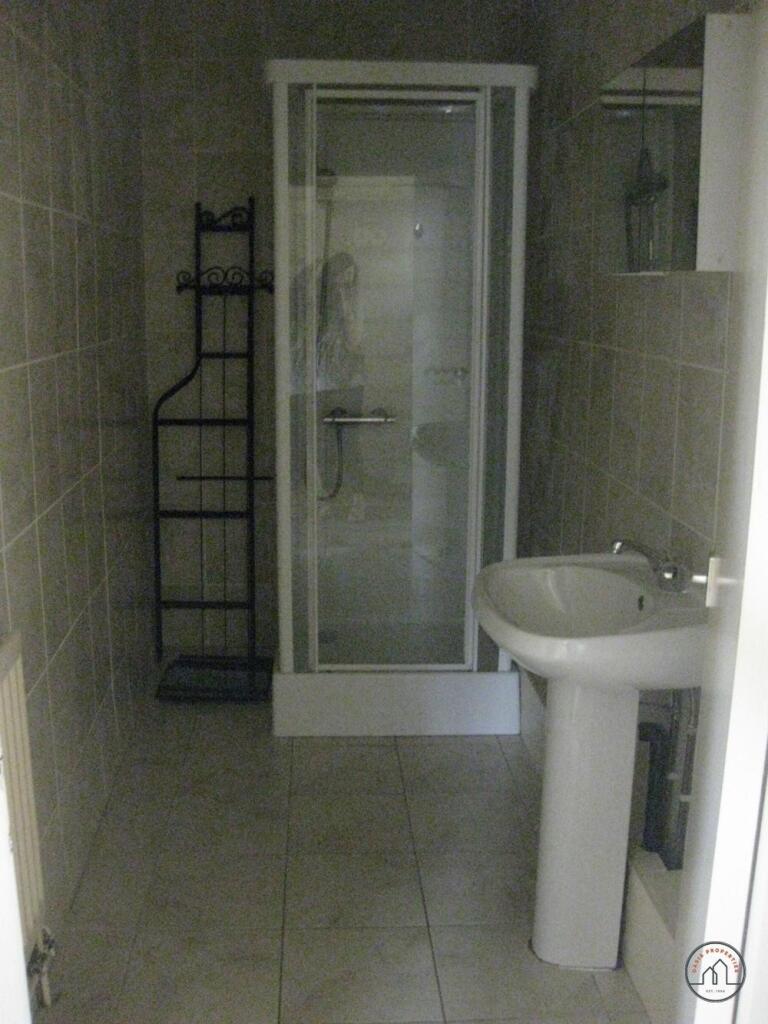 A clean, well-maintained bathroom featuring a s...