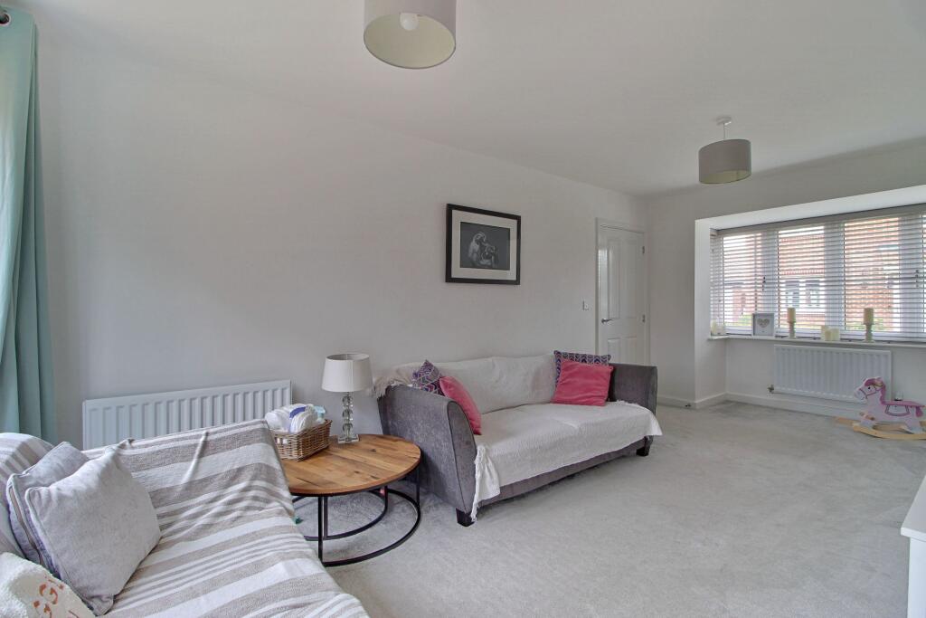 Living room with bay window and French doors