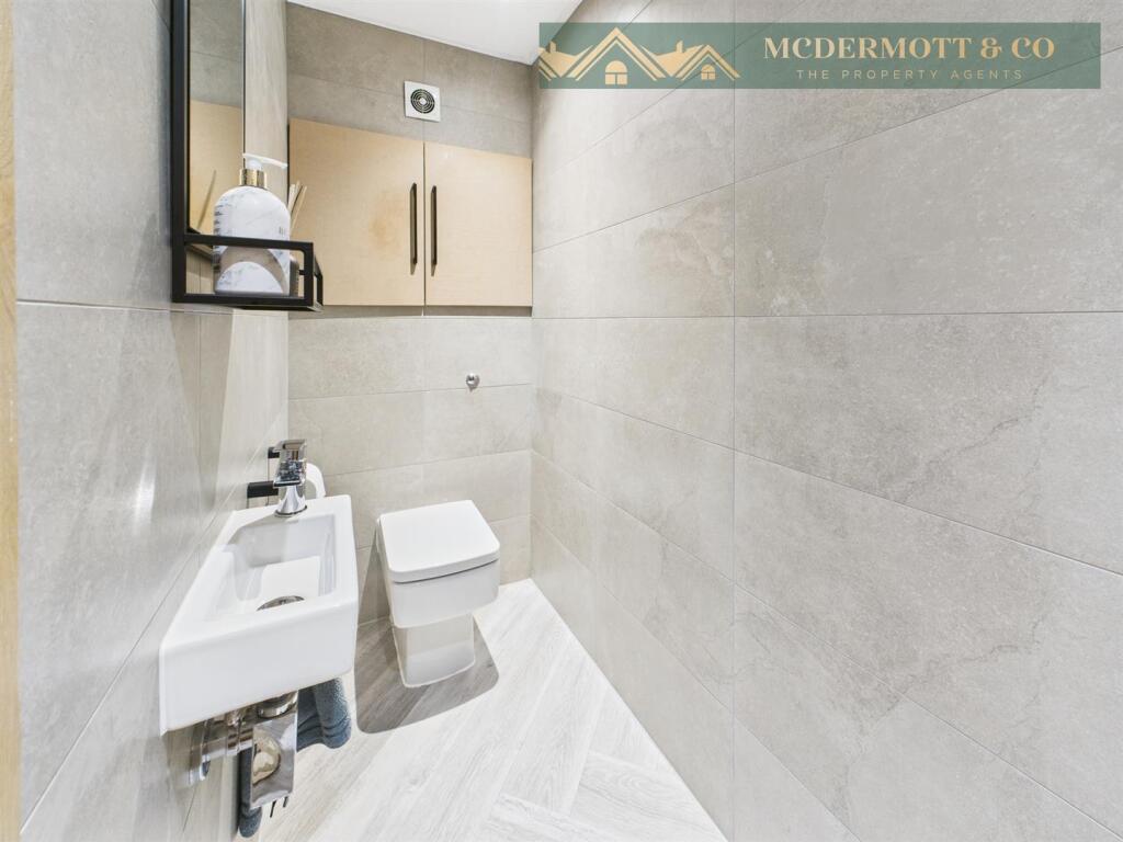 Downstairs cloaks/w.c.,