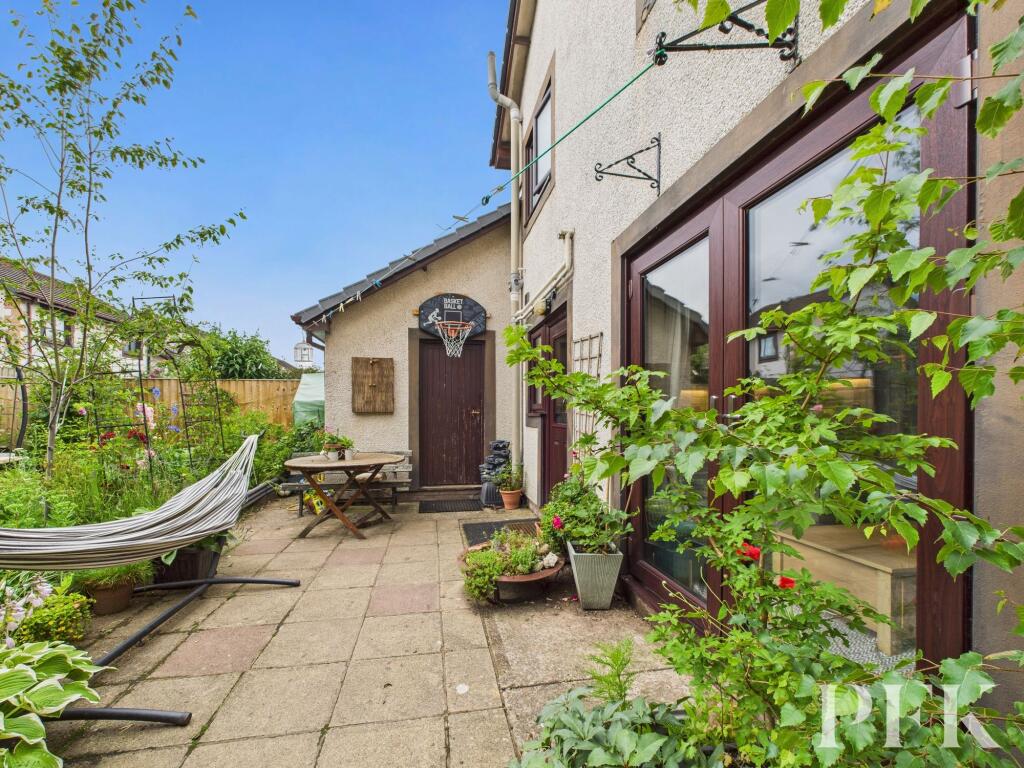 Rear patio and door to garage