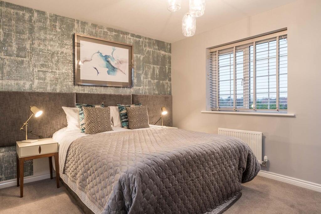 Bedroom 2 enjoys garden views