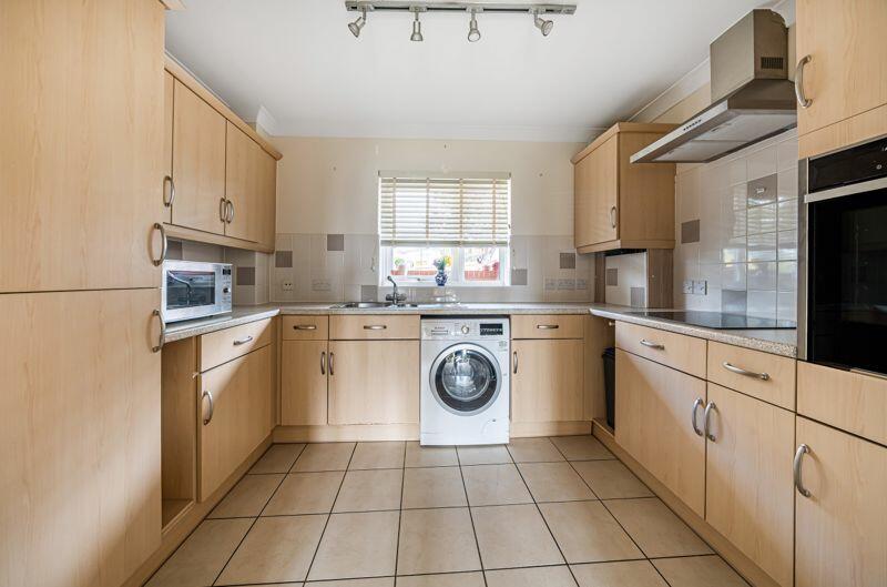 Kitchen with built-in appliances