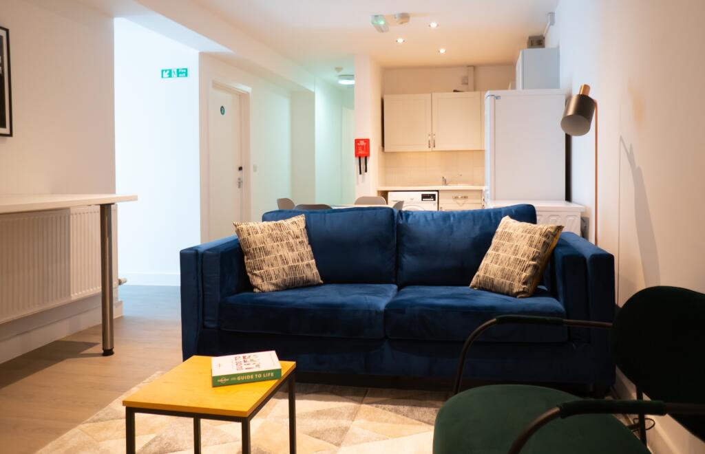 A spacious and well-lit modern living room feat...