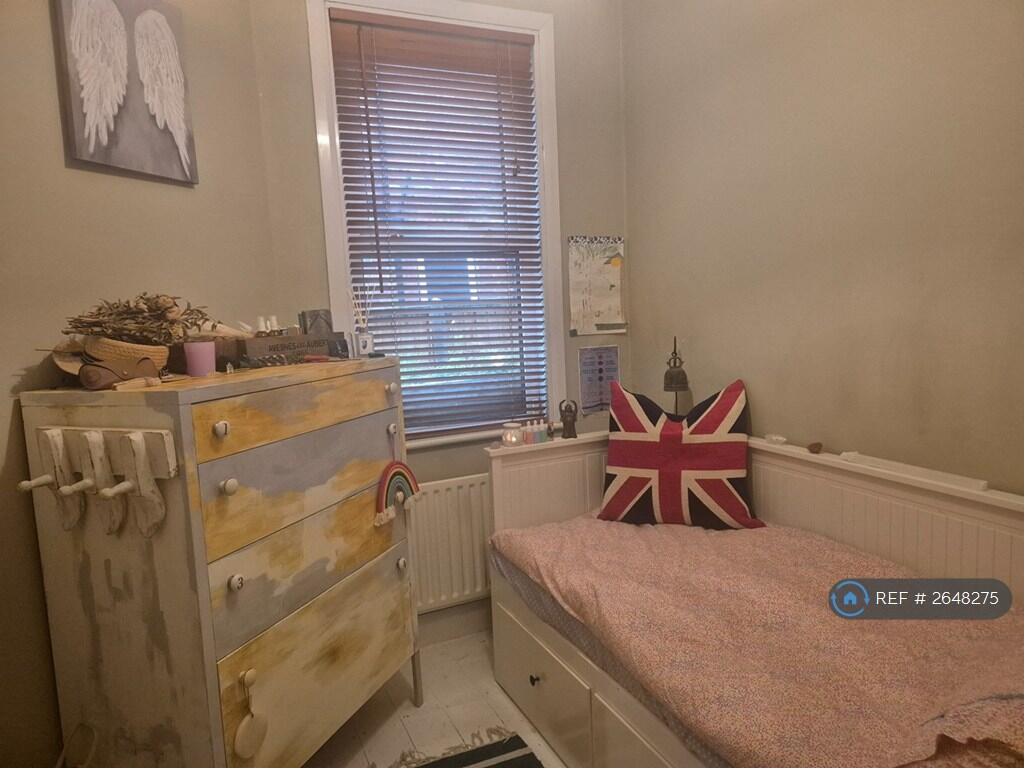 Bright Second Bedroom With Storage