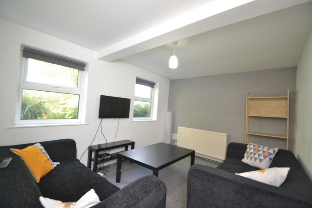 Spacious and inviting living room with abundant...
