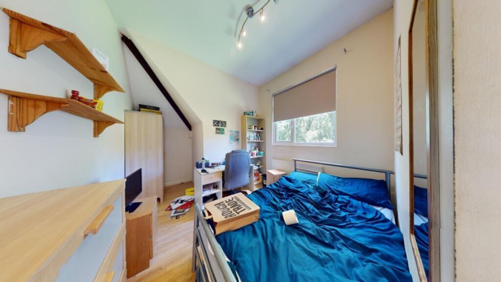 A bright and inviting double bedroom with ample...