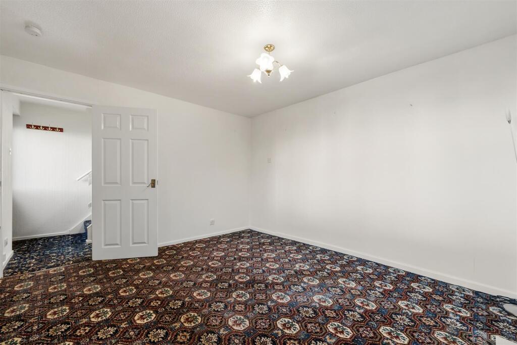 Sitting Room to entrance hallway.jpg