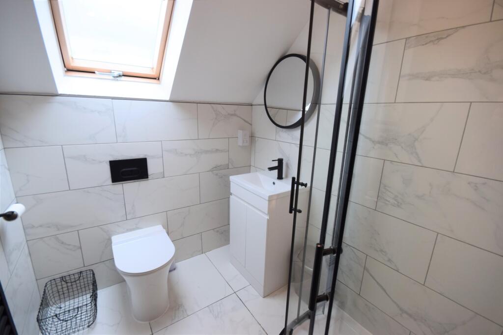 A stylish and modern bathroom featuring sleek t...