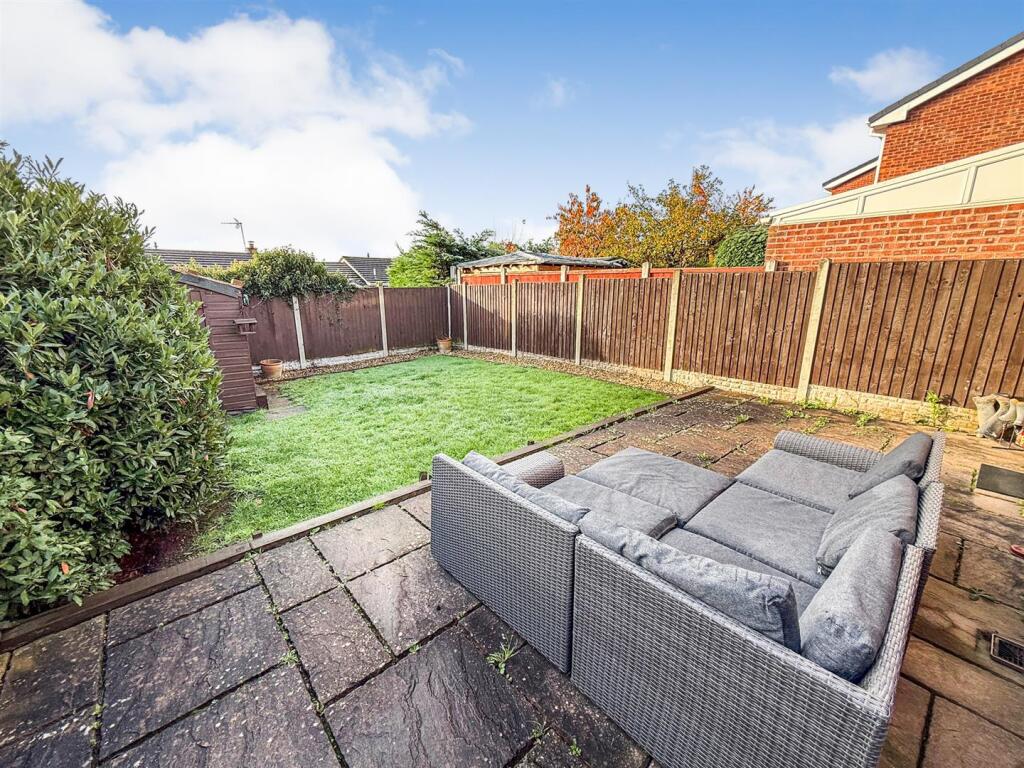 To The Rear Of The Property