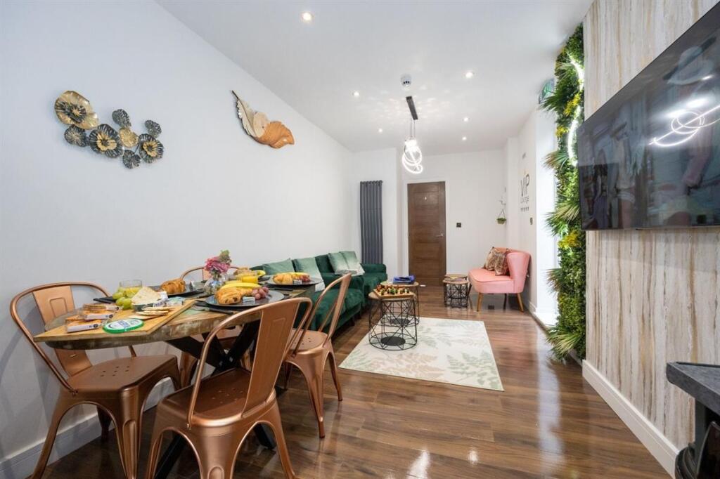 A contemporary living room featuring a stylish ...