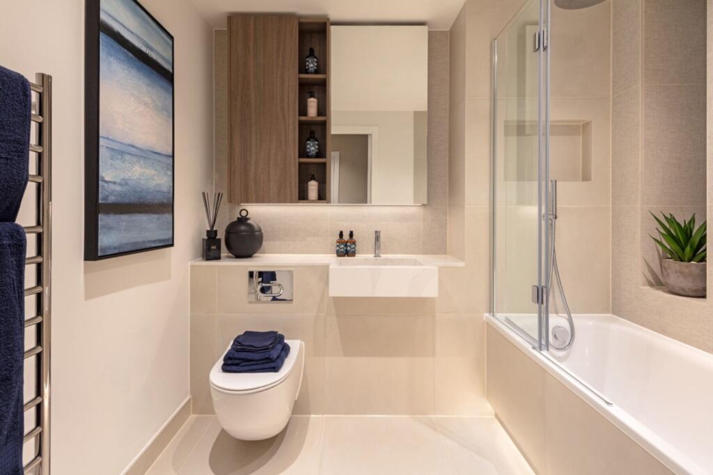Light bathroom with bespoke cabinetry &amp; vanity
