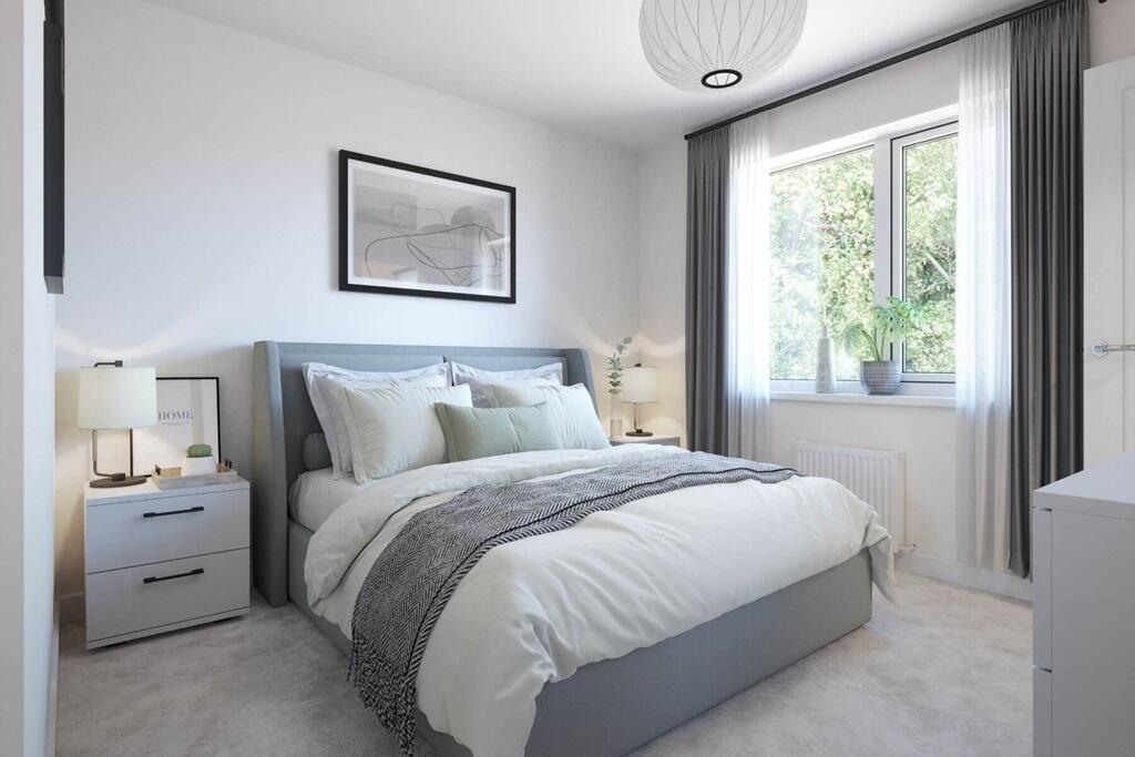 The main bedroom is a light-filled space with clean lines and a calm, airy feel