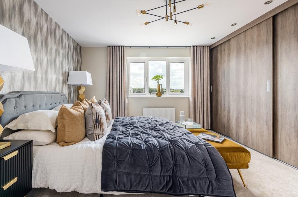 Bedroom 1 benefits from an en suite