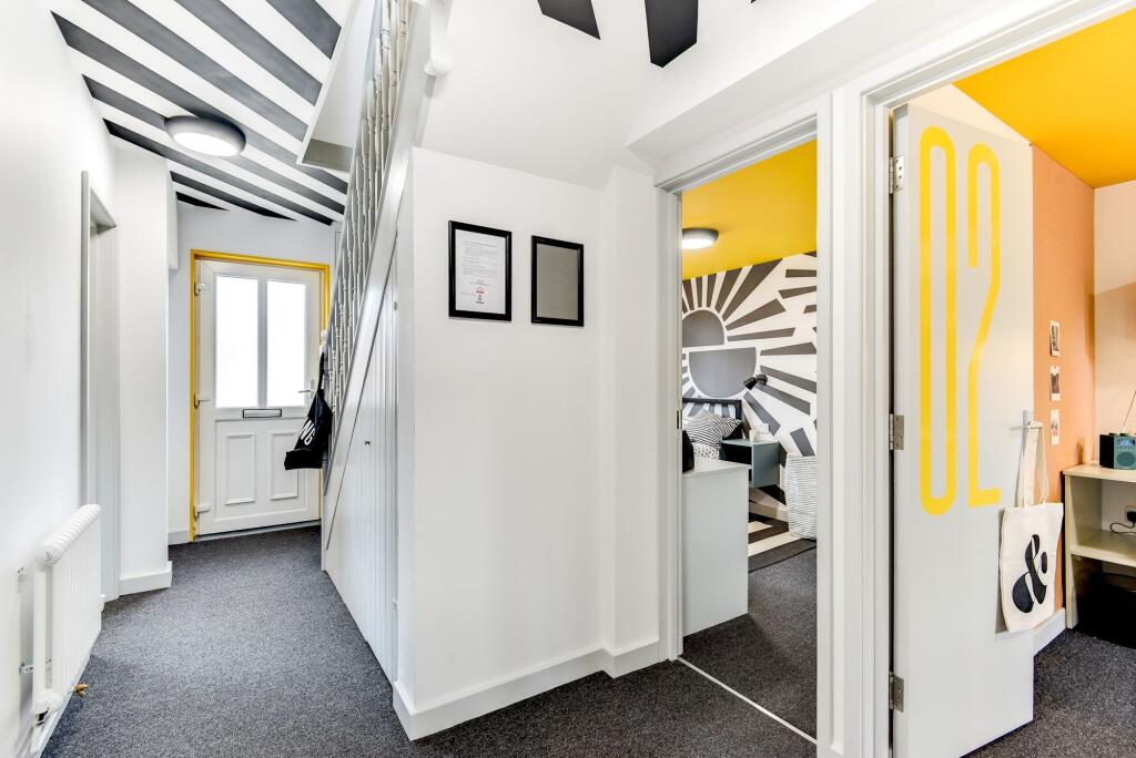 Bright and inviting hallway with modern decor, ...