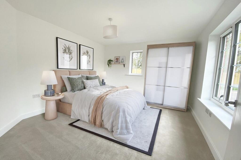 Light-filled main bedroom with plenty of space for bedroom furniture
