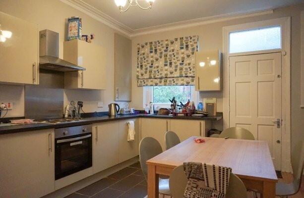 A cozy kitchen with functional appliances and a...
