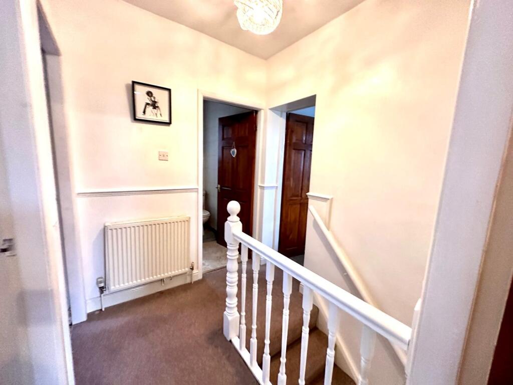 TO THE FIRST FLOOR LANDING