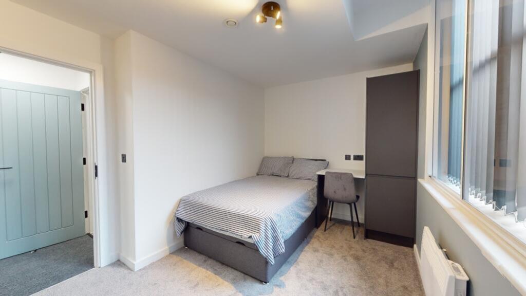 A spacious and bright double bedroom, perfect f...