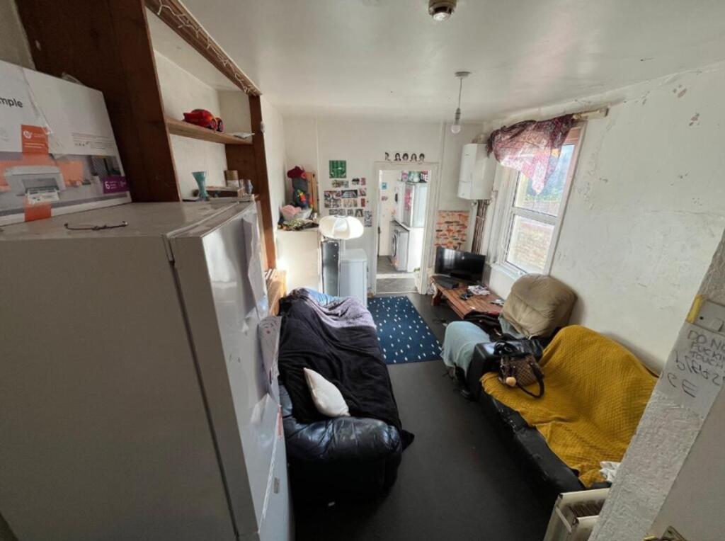 A cozy living room with a welcoming atmosphere,...