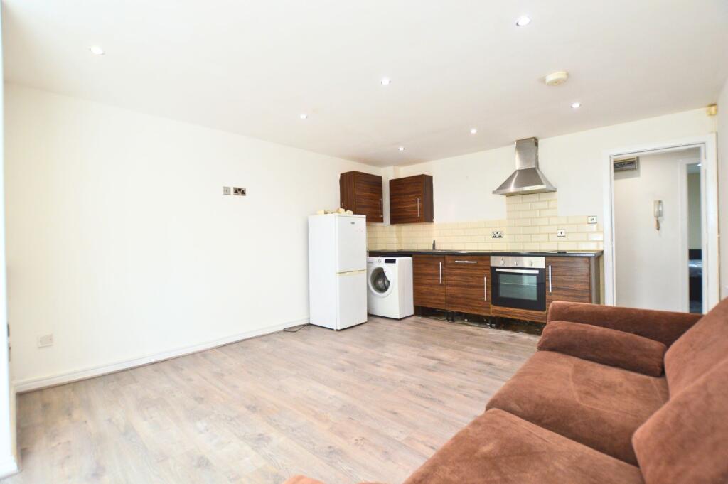 Bright and clean open-plan living room with mod...