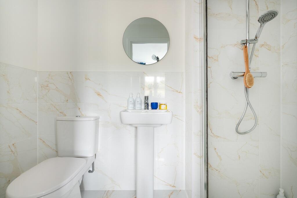 The main bedroom also benefits from it's own en suite shower room