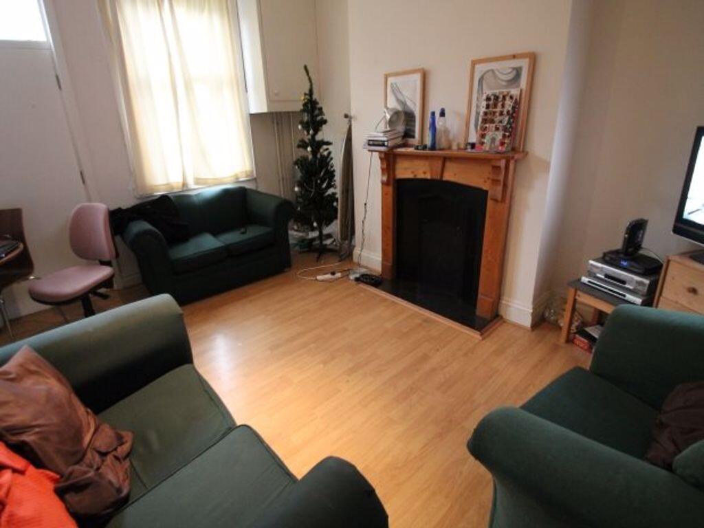 A cozy living room with natural light filtering...
