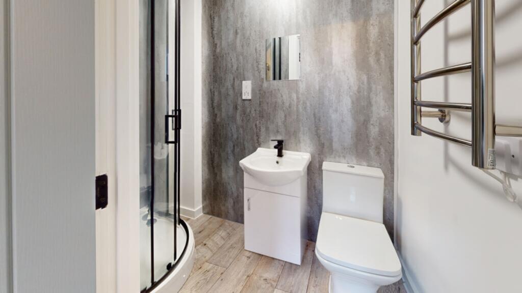 A modern and clean bathroom featuring a sleek d...