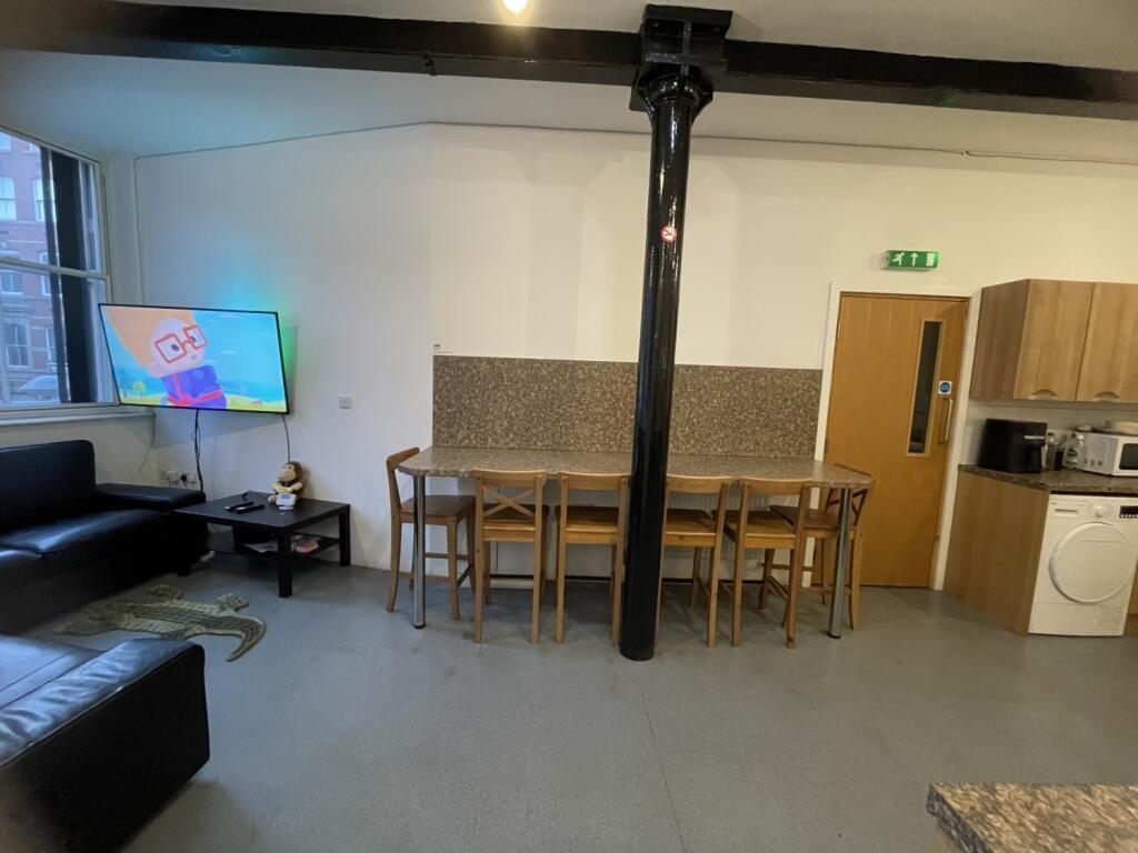 Contemporary living area featuring a spacious s...