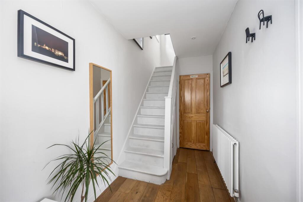 Stairs rising to First Floor