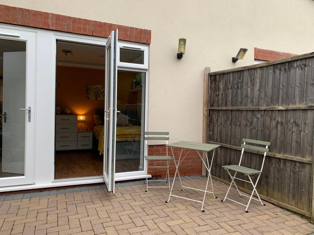 A charming outdoor space with seating, perfect ...