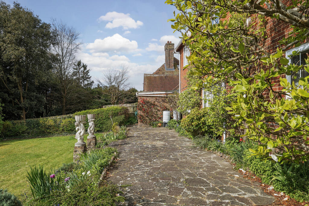 Large South facing rear terrace and garden